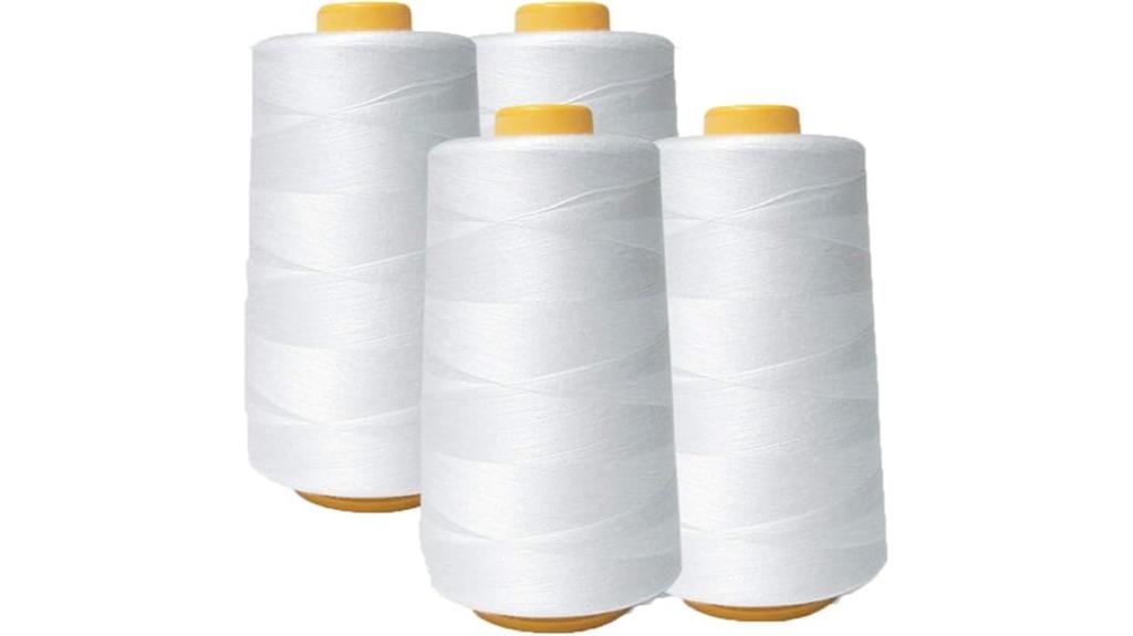 four white sewing thread cones
